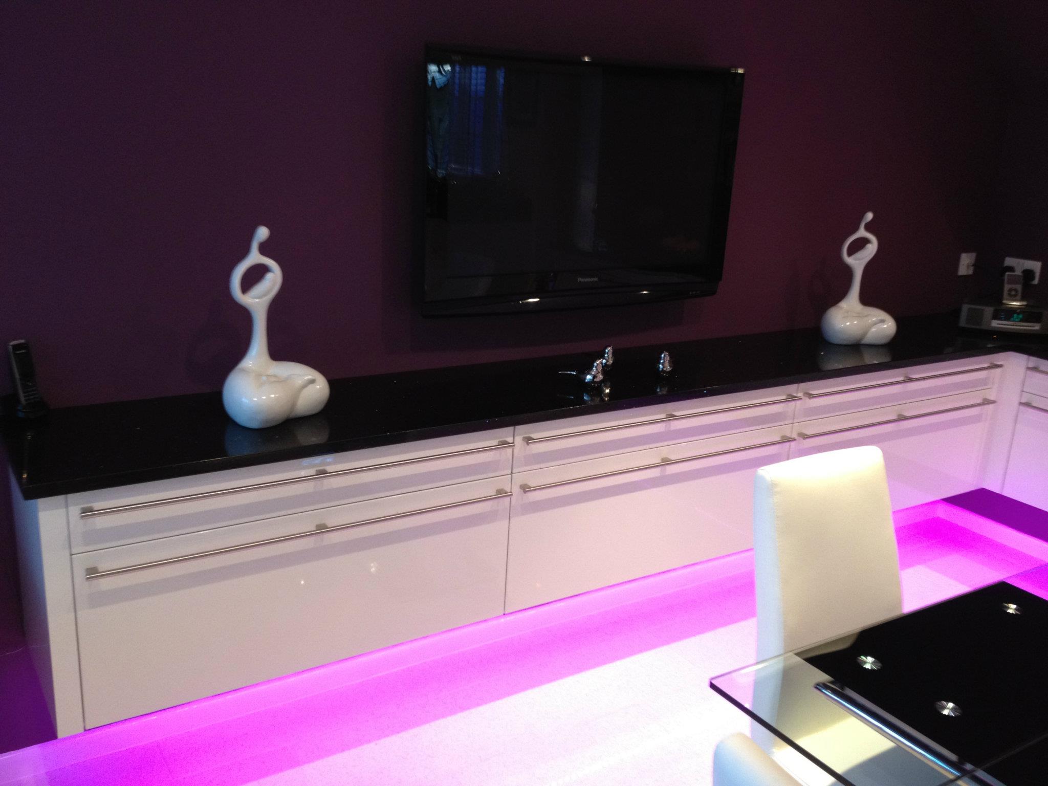 Cambia in high gloss, with feature lighting — a Rational kitchen by Kitchensmiths (photograph 1 of 4)