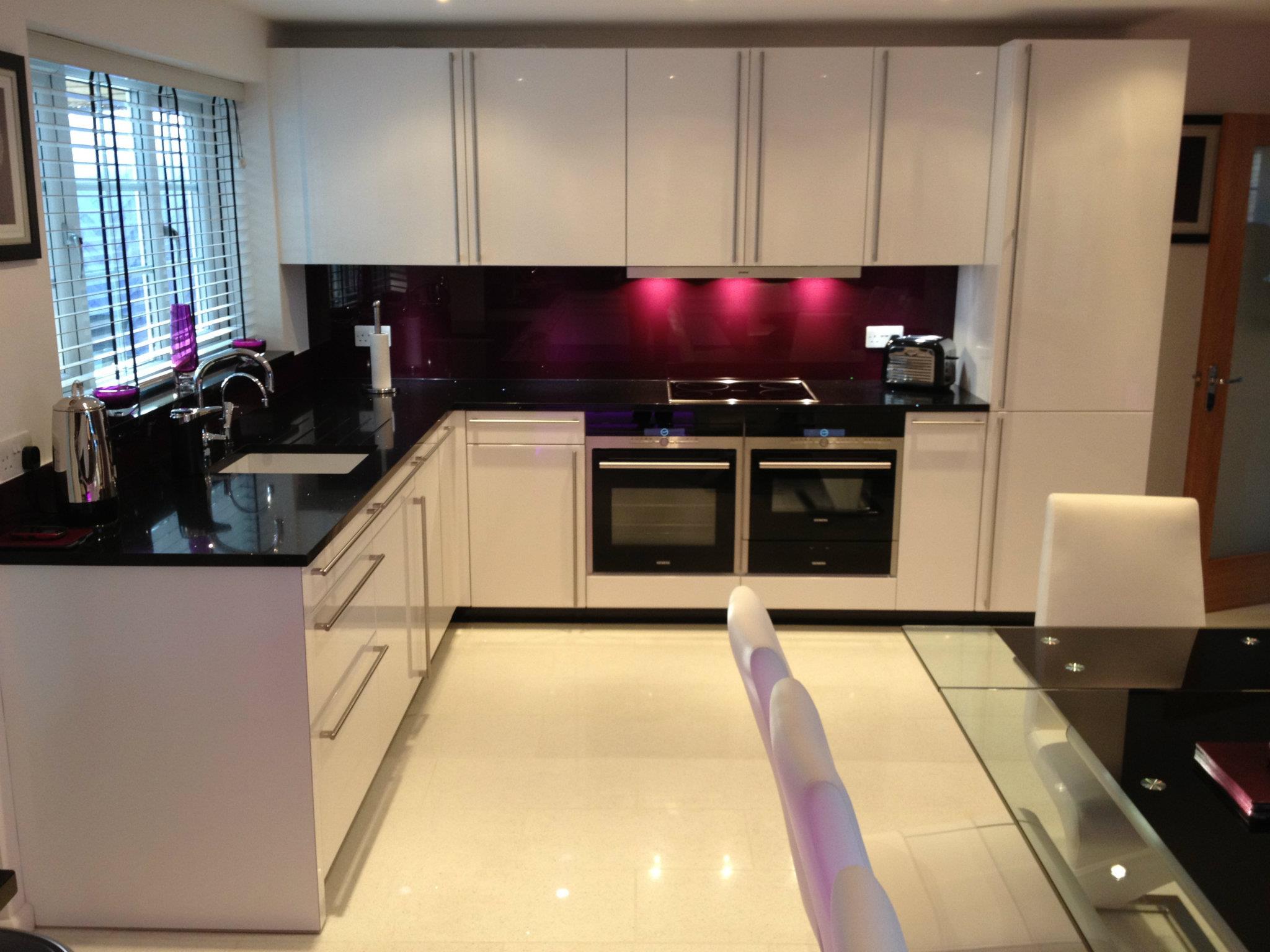 Cambia in high gloss, with feature lighting — a Rational kitchen by Kitchensmiths (photograph 2 of 4)