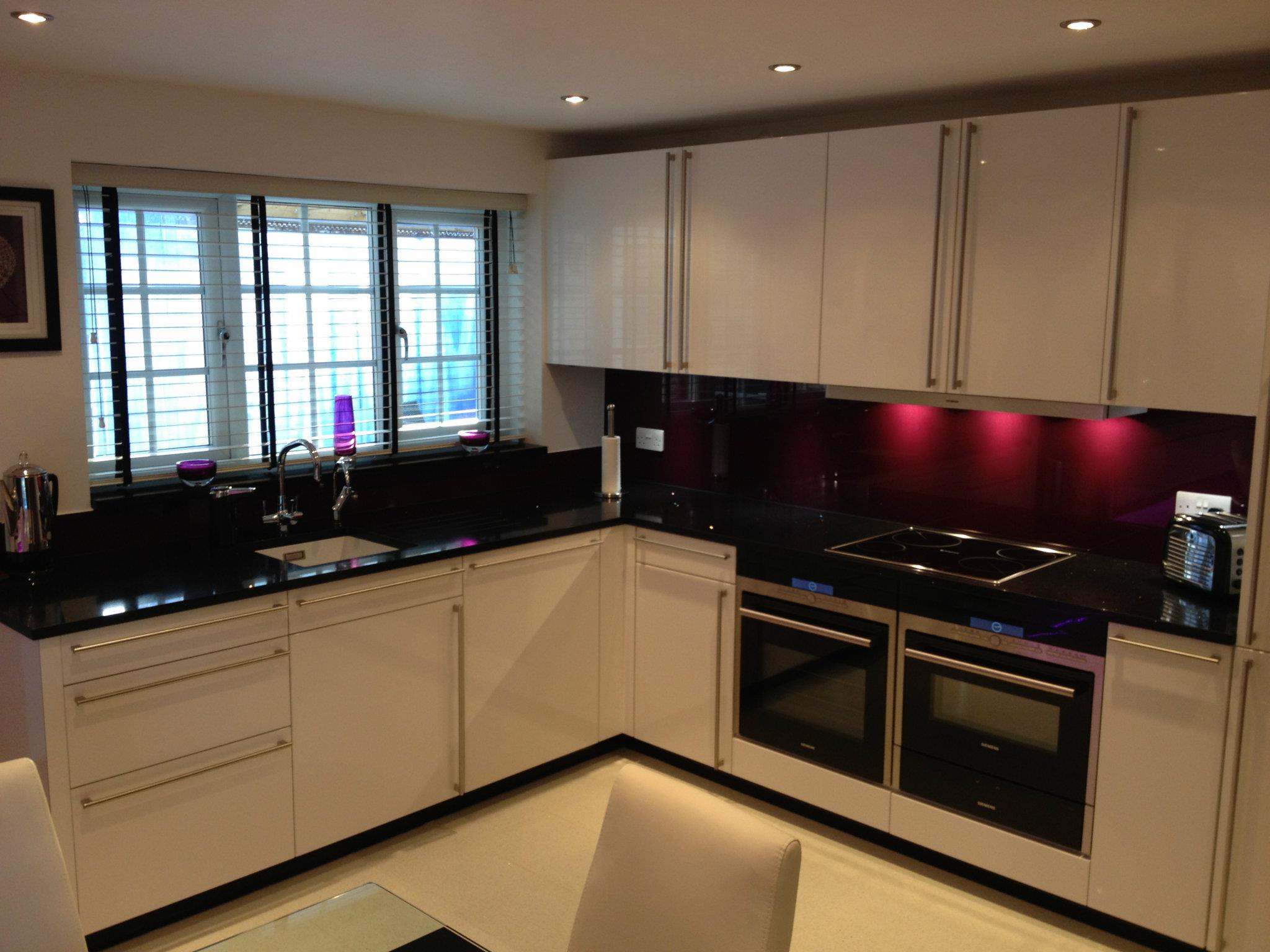Cambia in high gloss, with feature lighting — a Rational kitchen by Kitchensmiths (photograph 3 of 4)