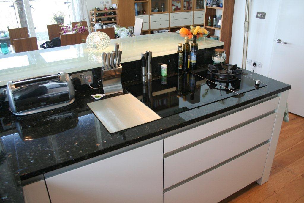 Atmos in glass, with Emerald Pearl — a Rational kitchen by Kitchensmiths, with granite worktops (photograph 2 of 8)