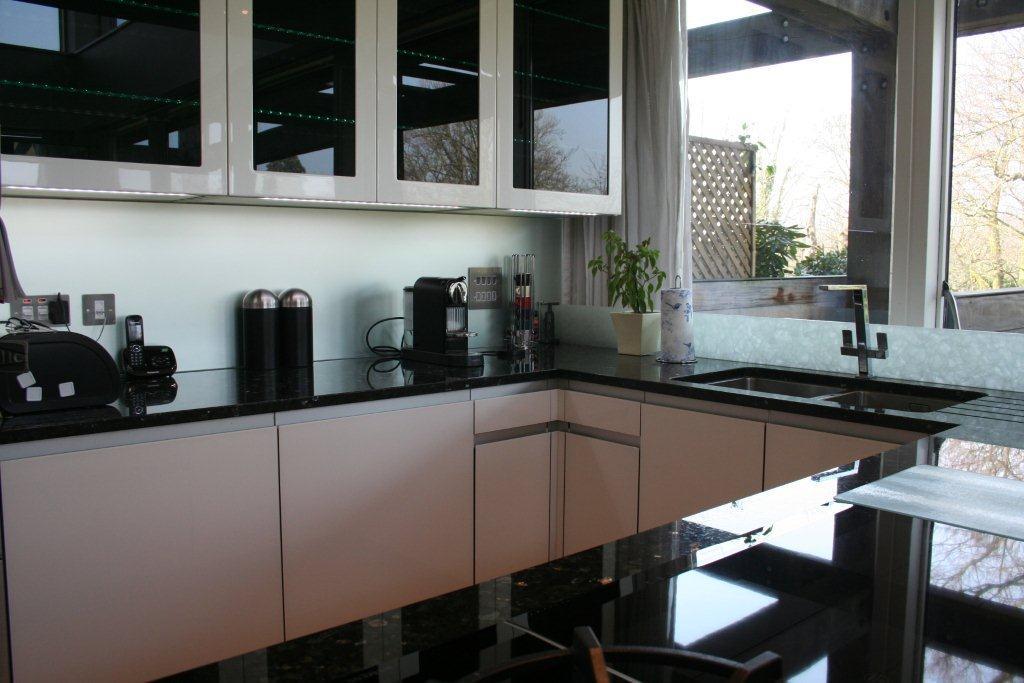Atmos in glass, with Emerald Pearl — a Rational kitchen by Kitchensmiths, with granite worktops (photograph 5 of 8)