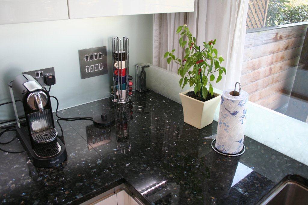 Atmos in glass, with Emerald Pearl — a Rational kitchen by Kitchensmiths, with granite worktops (photograph 6 of 8)