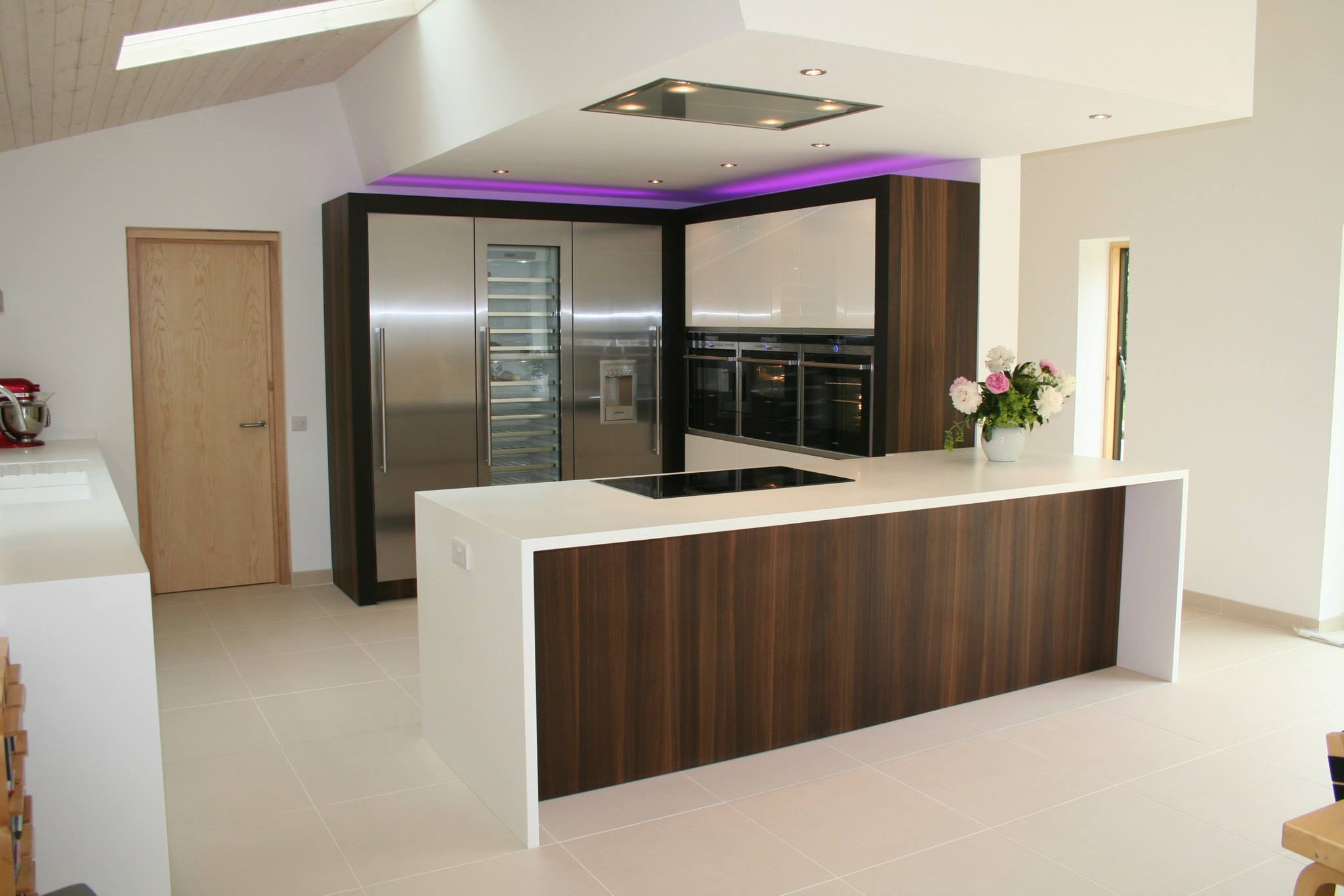 Atmos in high gloss white, with smoked oak — a Rational kitchen by Kitchensmiths (photograph 1 of 4)