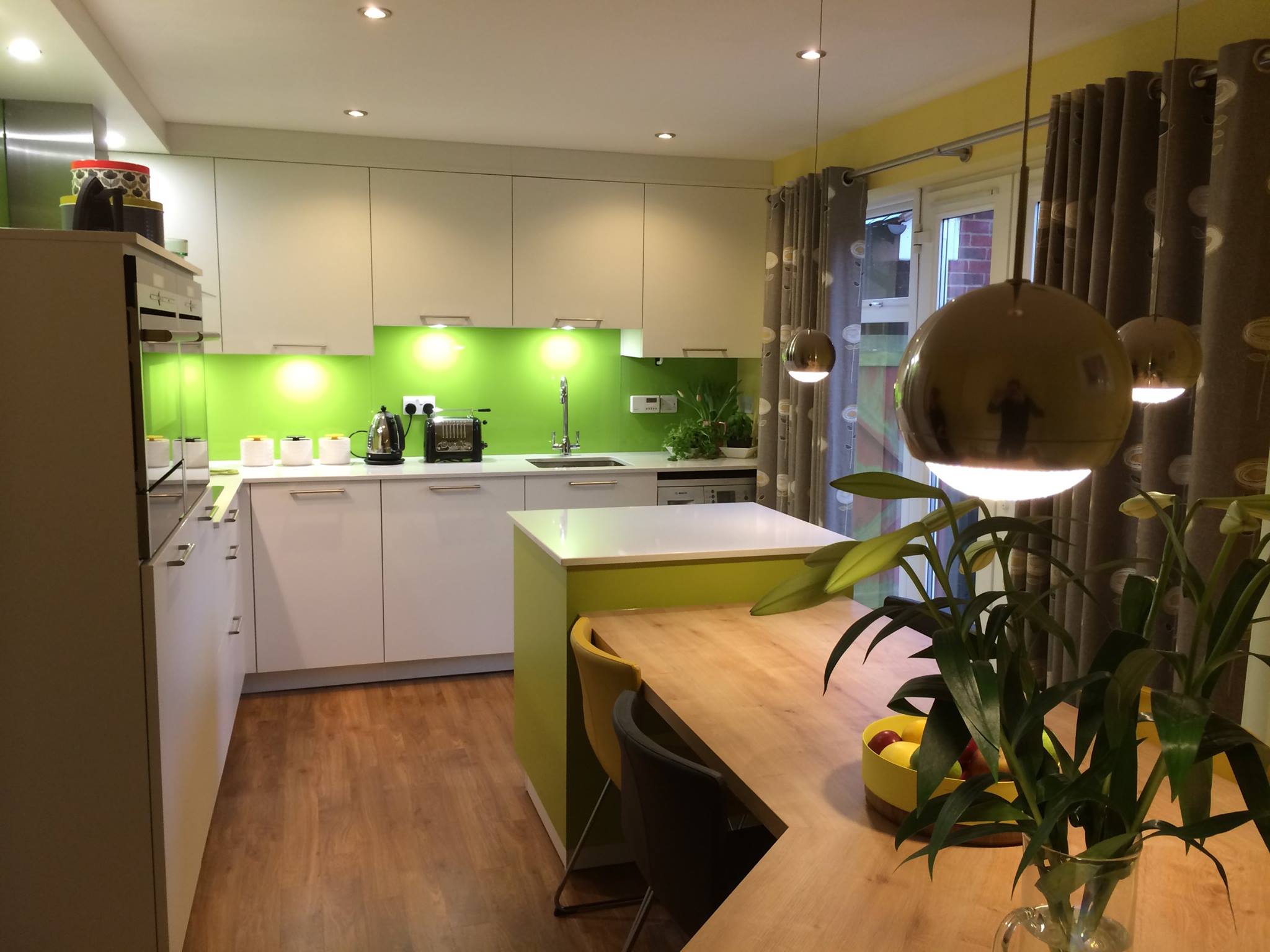 LANO in polar white, with apple green glass — a Rational kitchen by Kitchensmiths