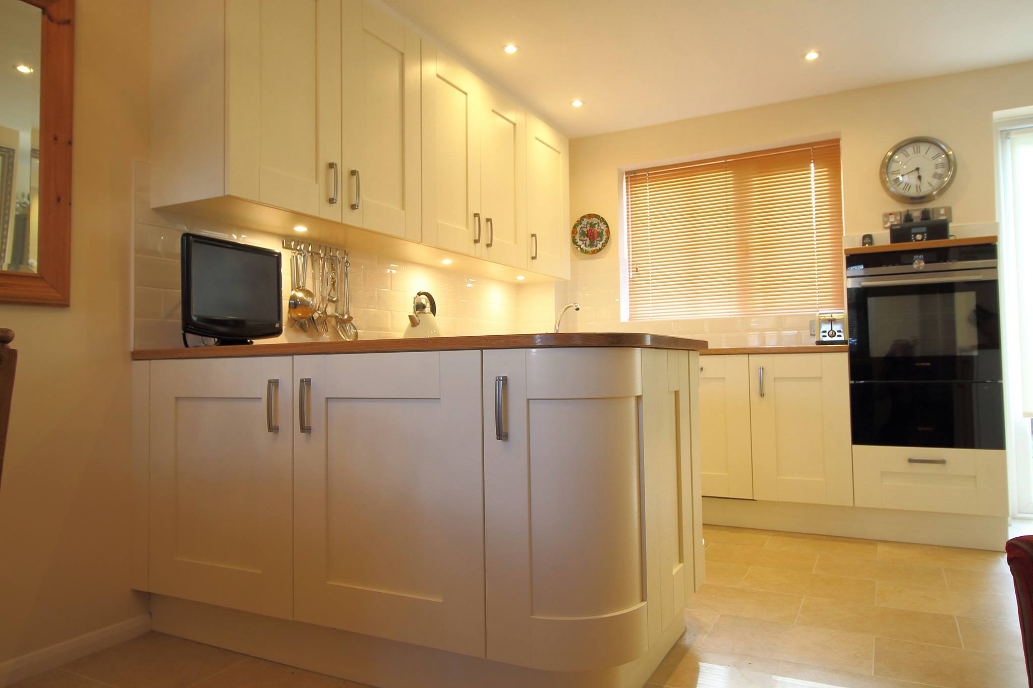 Broxbourne in Ivory, with solid oak — a Stoneham kitchen by Kitchensmiths, with solid oak worktops (photograph 1 of 5)