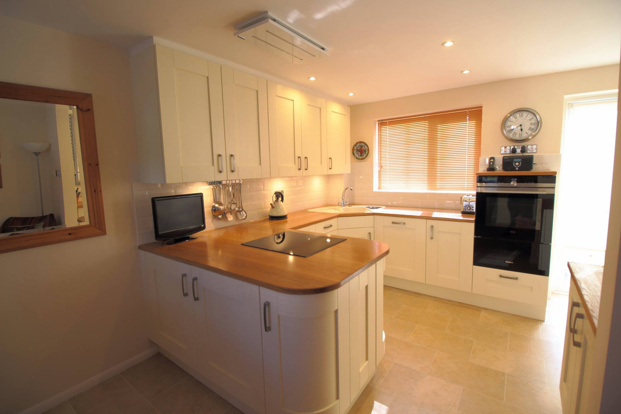 Broxbourne in Ivory, with solid oak — a Stoneham kitchen by Kitchensmiths, with solid oak worktops (photograph 4 of 5)