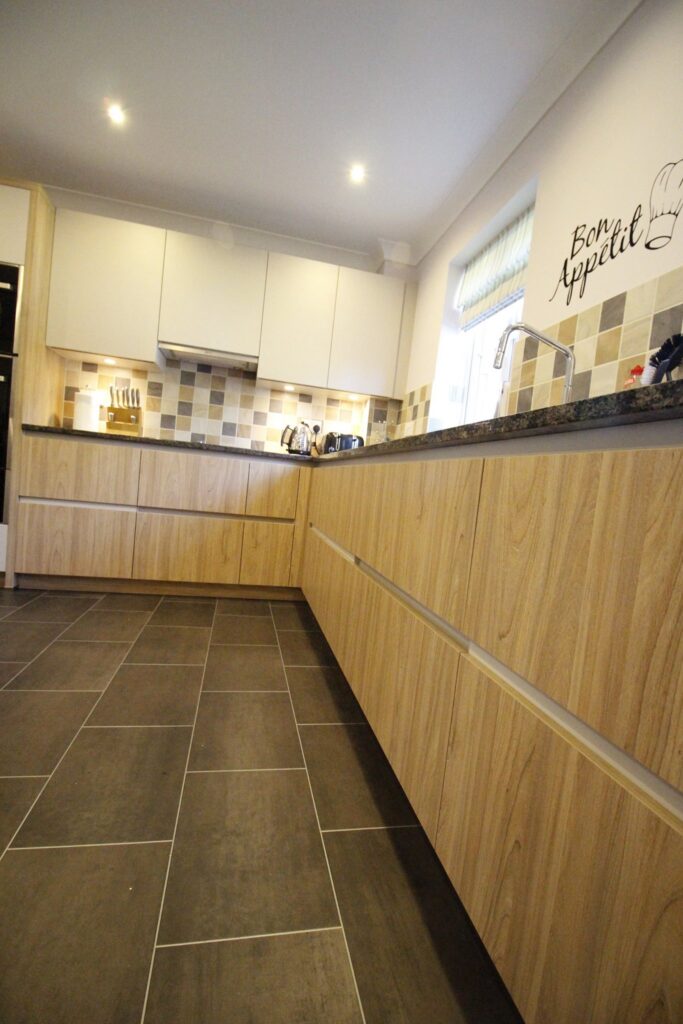 Purista, in sapphire brown granite — a Bauformat kitchen by Kitchensmiths (photograph 1 of 5)