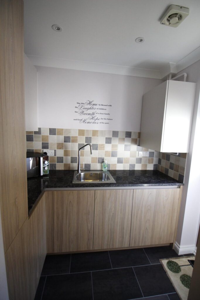 Purista, in sapphire brown granite — a Bauformat kitchen by Kitchensmiths (photograph 3 of 5)