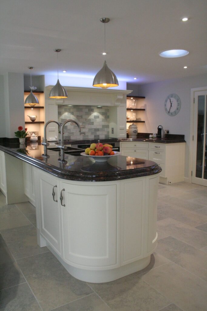 Penshurst painted in Ivory — a Stoneham kitchen by Kitchensmiths, with granite worktops (photograph 1 of 6)