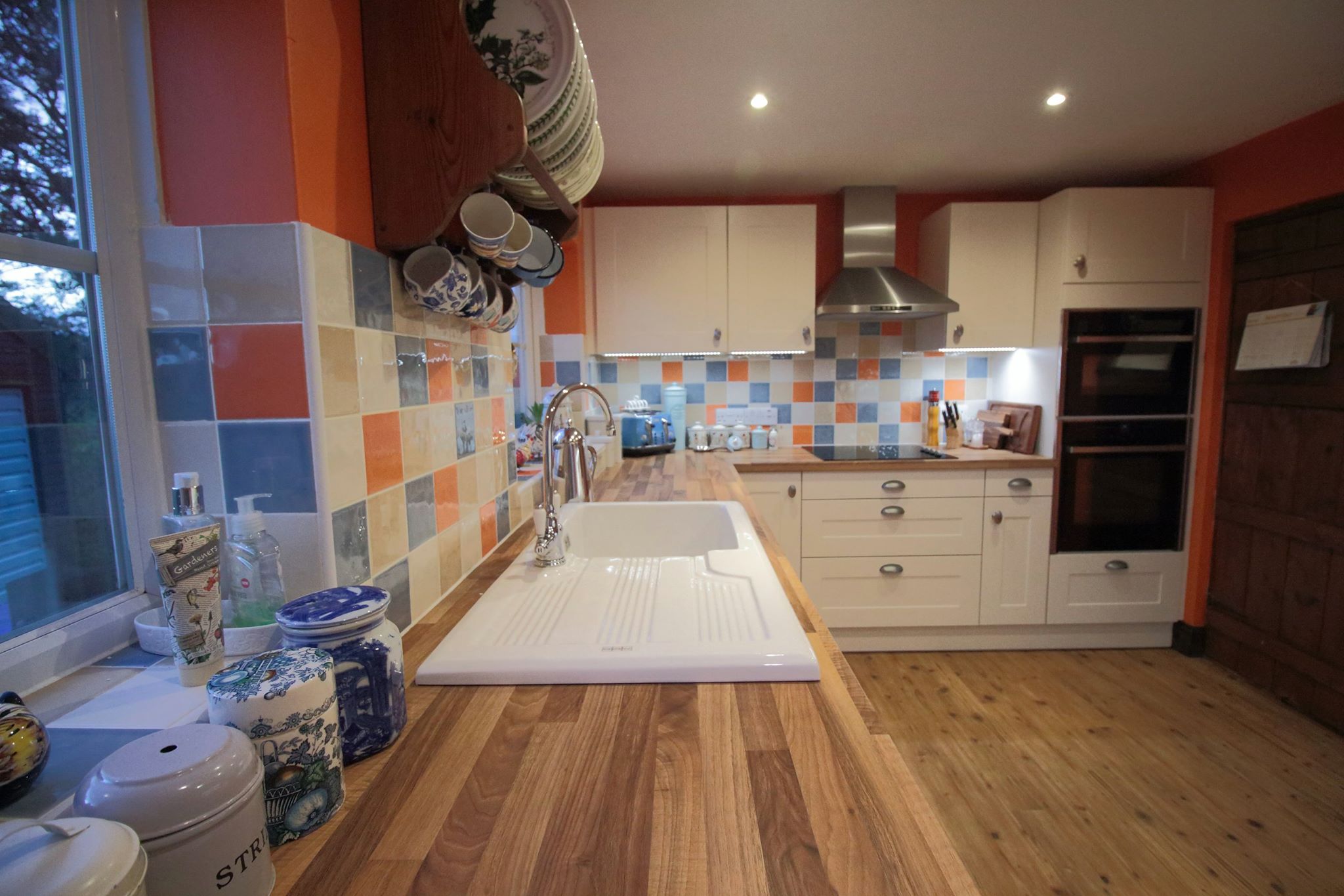 Magnolia shaker in Blyford — a kitchen by Kitchensmiths, with walnut worktops (photograph 1 of 4)