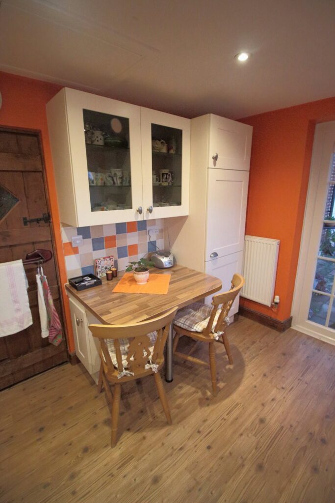 Magnolia shaker in Blyford — a kitchen by Kitchensmiths, with walnut worktops (photograph 2 of 4)