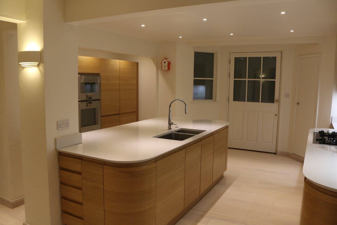 Flow in light oak — a Stoneham kitchen by Kitchensmiths, with silestone worktops (photograph 2 of 7)