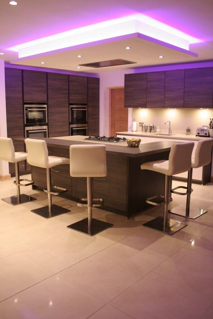 Handleless, fully specified — a kitchen by Kitchensmiths, with silestone worktops (photograph 1 of 8)