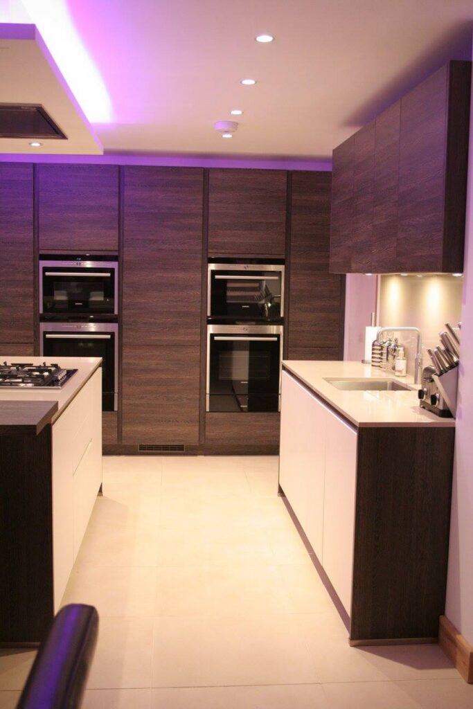 Handleless, fully specified — a kitchen by Kitchensmiths, with silestone worktops (photograph 3 of 8)