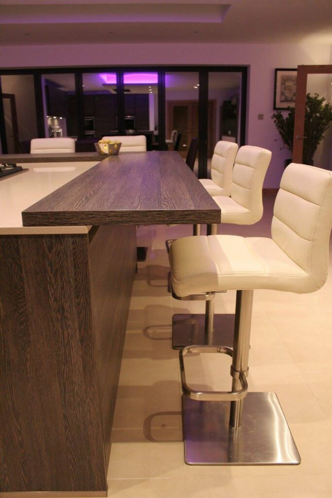 Handleless, fully specified — a kitchen by Kitchensmiths, with silestone worktops (photograph 7 of 8)