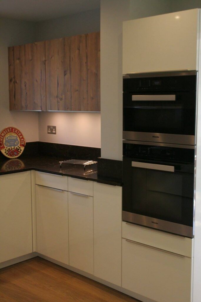Puro, with Caesarstone Woodlands — a Rational kitchen by Kitchensmiths, with caesarstone Woodlands worktops (photograph 1 of 6)