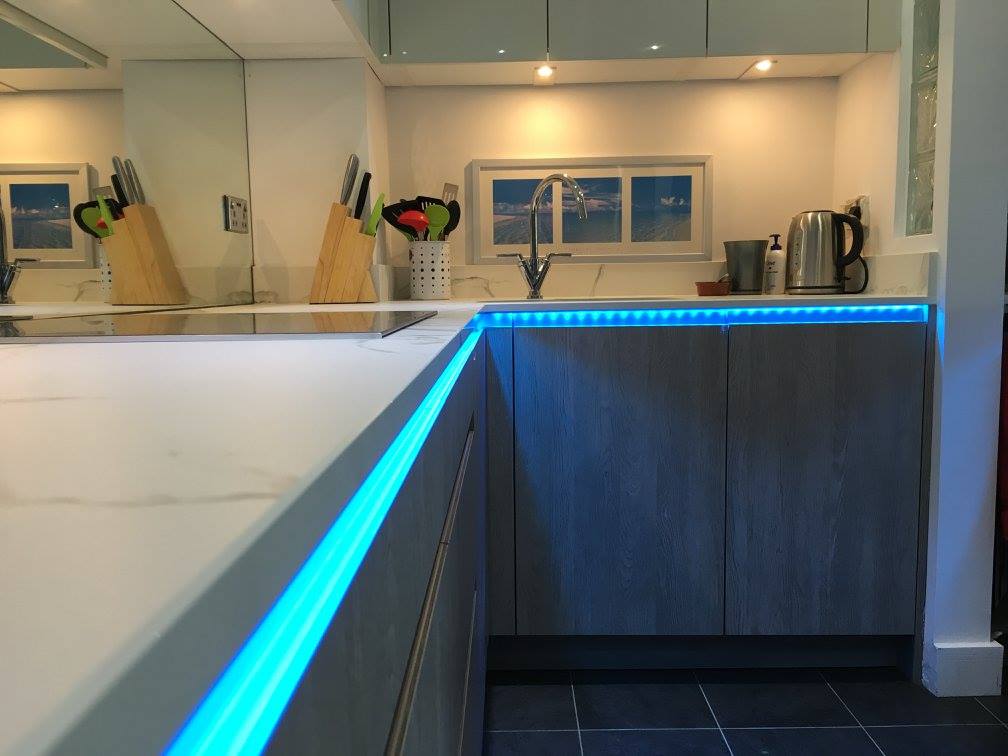 TIO, with Dekton Aura and feature lighting — a kitchen by Kitchensmiths, with dekton Aura worktops (photograph 4 of 5)