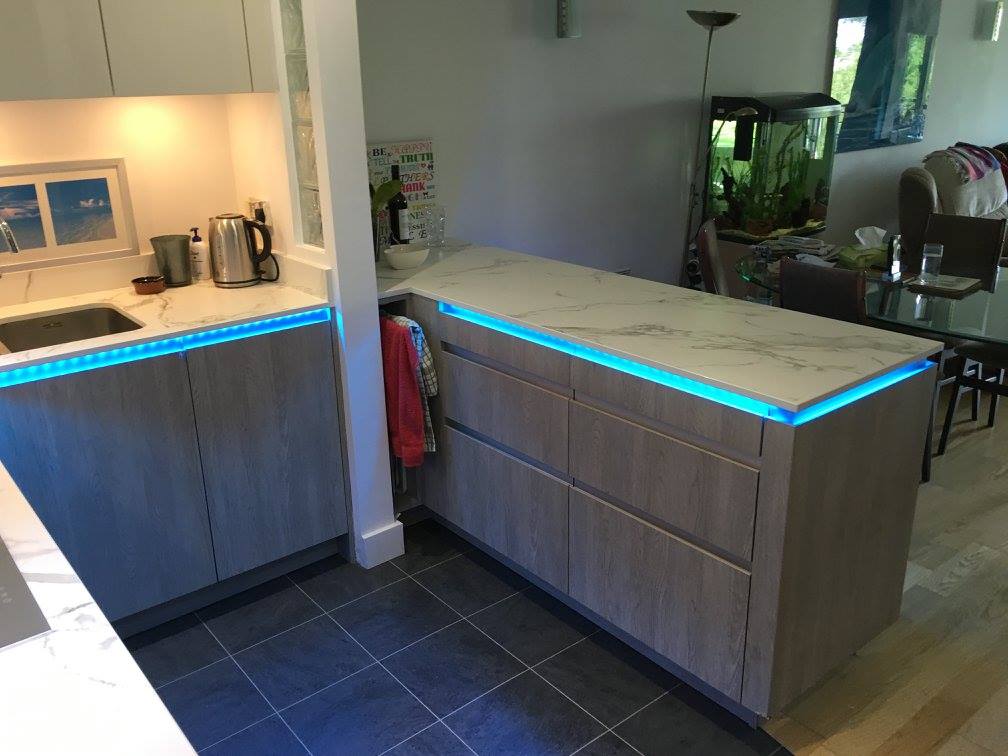 TIO, with Dekton Aura and feature lighting — a kitchen by Kitchensmiths, with dekton Aura worktops (photograph 5 of 5)