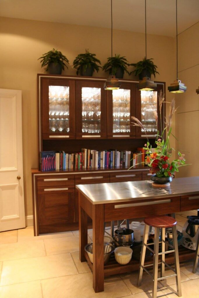 A dresser and an island — a Stoneham kitchen by Kitchensmiths, with stainless steel worktops (photograph 1 of 8)