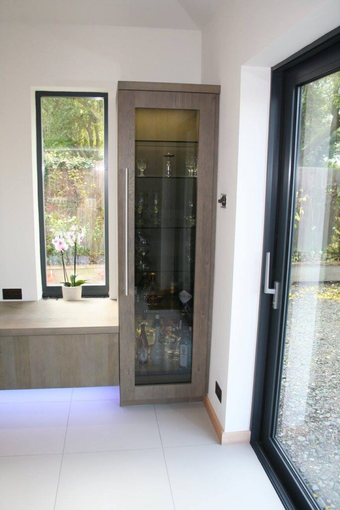 High gloss white with terra oak — a Rational kitchen by Kitchensmiths (photograph 7 of 8)