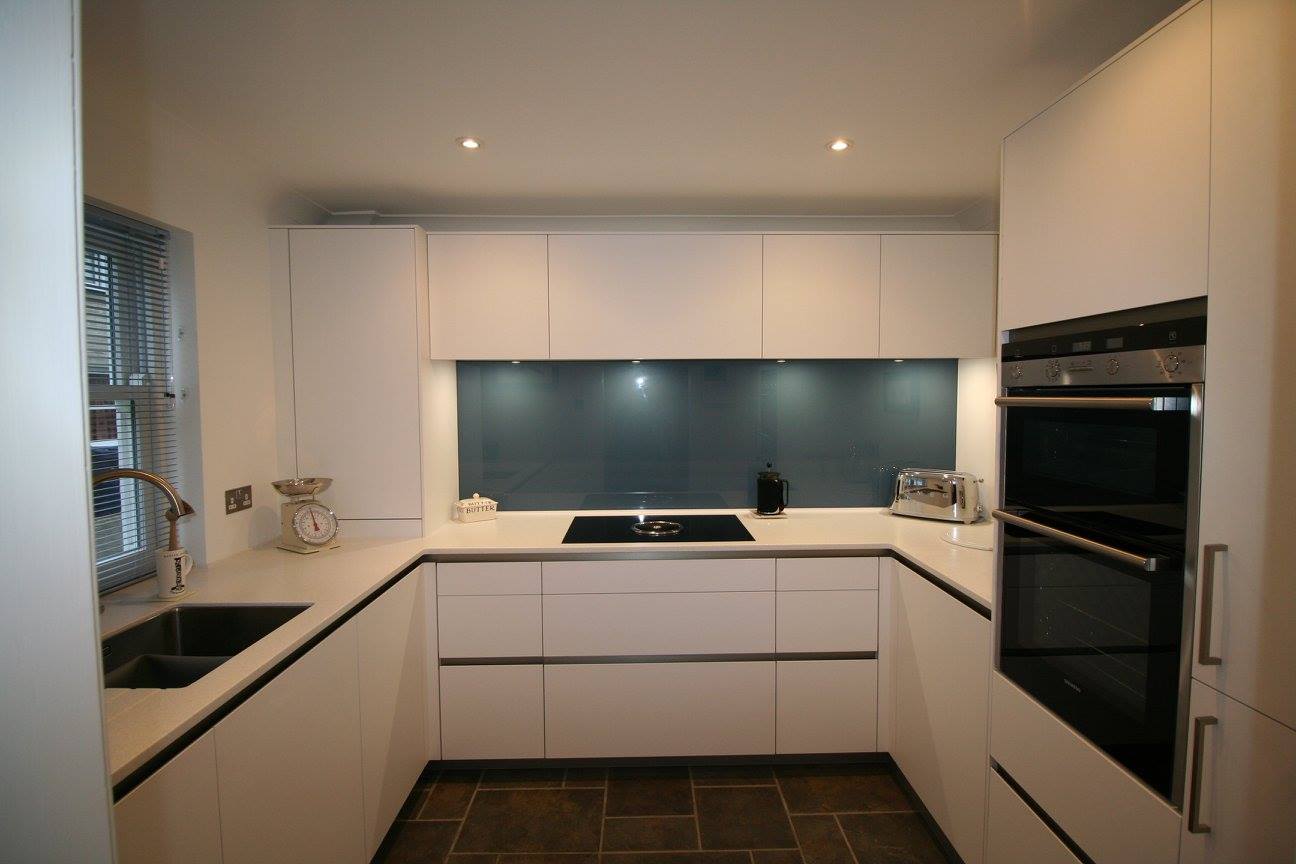 A sleek look for a small kitchen — a Rational kitchen by Kitchensmiths, with corian Everest worktops (photograph 2 of 2)