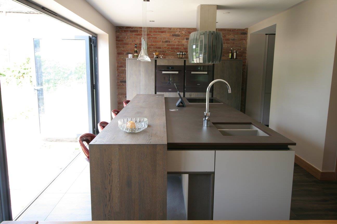 Sleek German kitchen with Dekton worktops — a kitchen by Kitchensmiths, with dekton worktops (photograph 1 of 16)