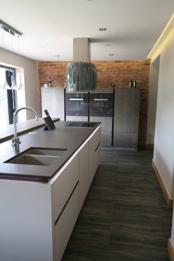 Sleek German kitchen with Dekton worktops — a kitchen by Kitchensmiths, with dekton worktops (photograph 6 of 16)