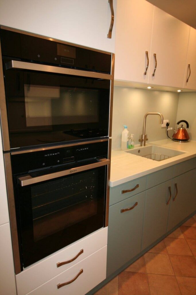 Classic White and Blue Ashes — a Stoneham kitchen by Kitchensmiths, with corian worktops (photograph 1 of 6)