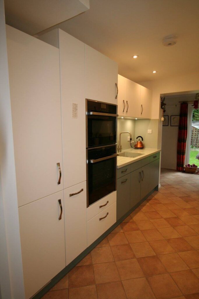 Classic White and Blue Ashes — a Stoneham kitchen by Kitchensmiths, with corian worktops (photograph 3 of 6)