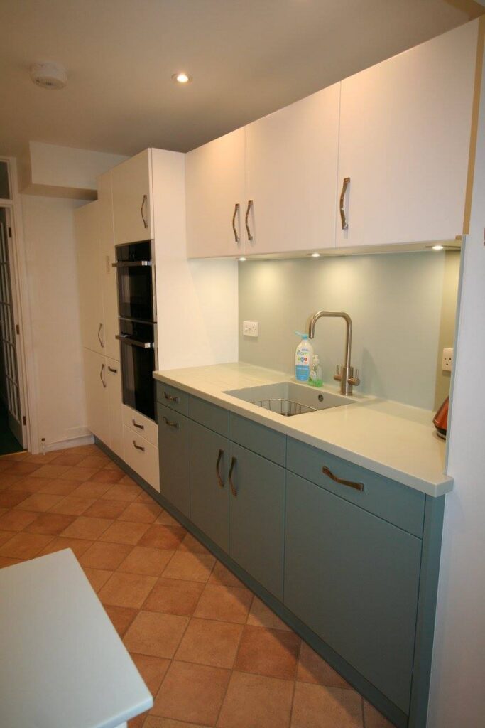 Classic White and Blue Ashes — a Stoneham kitchen by Kitchensmiths, with corian worktops (photograph 5 of 6)