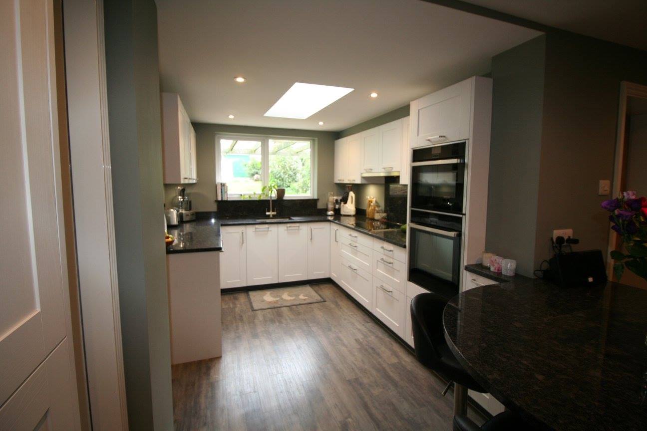 White shaker, steel grey granite — a Störmer kitchen by Kitchensmiths (photograph 2 of 7)