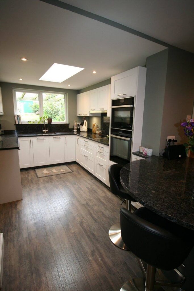 White shaker, steel grey granite — a Störmer kitchen by Kitchensmiths (photograph 4 of 7)