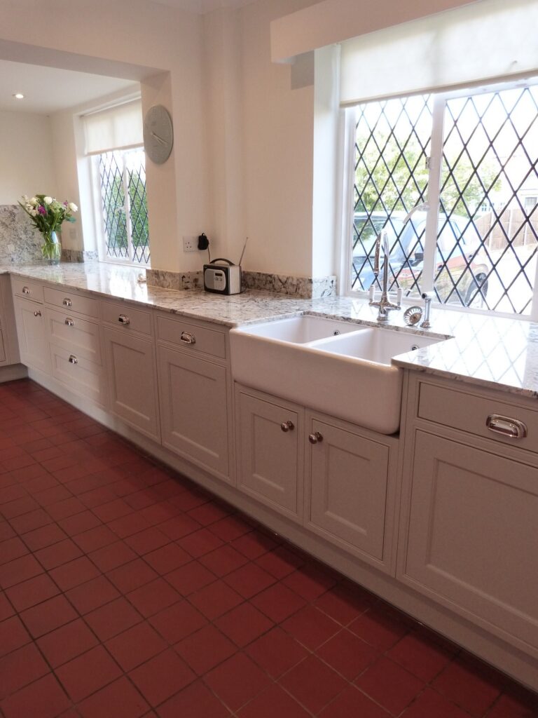Cashmere smooth paint, in-frame — a Stoneham kitchen by Kitchensmiths, with sensa worktops (photograph 1 of 5)