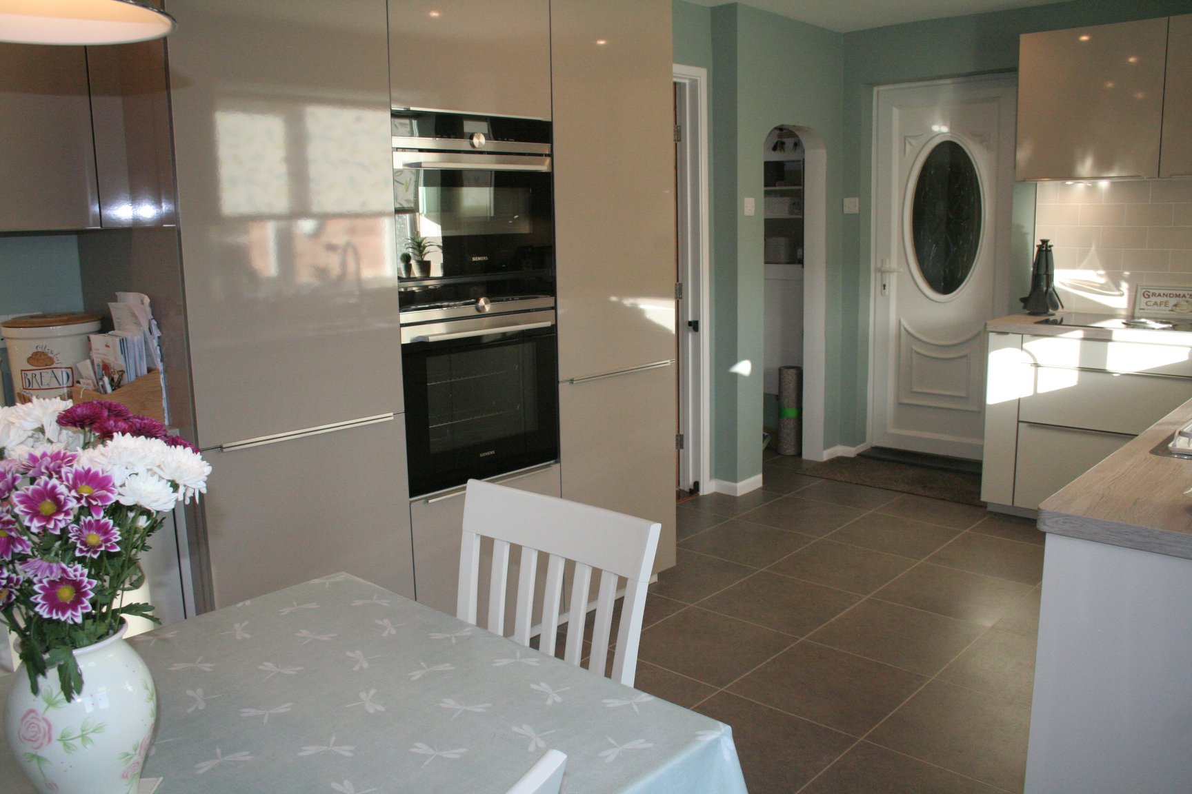 Puro in Natural High Gloss — a Rational kitchen by Kitchensmiths, with oak worktops (photograph 2 of 3)
