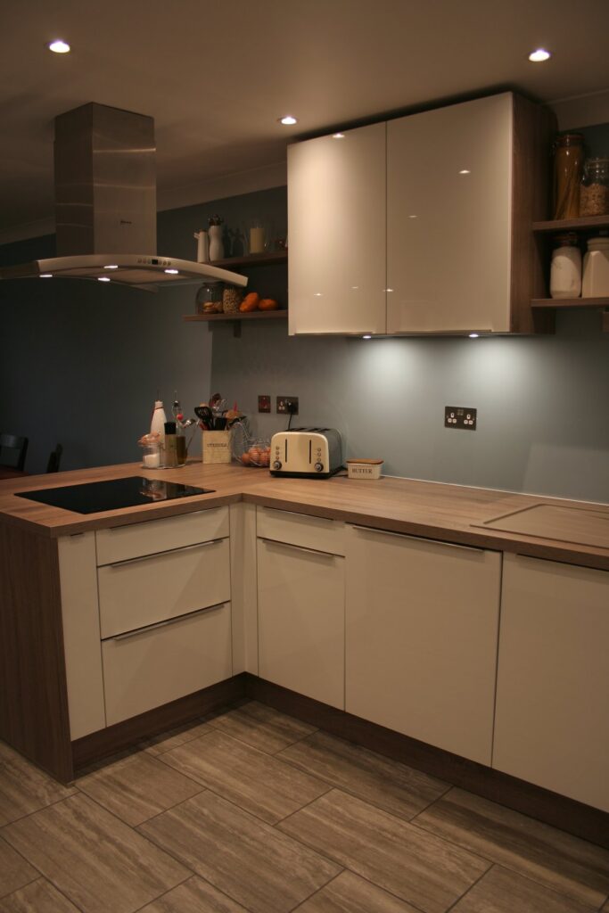 Como High Gloss White, with dark oak — a Störmer kitchen by Kitchensmiths, with oak worktops (photograph 2 of 8)