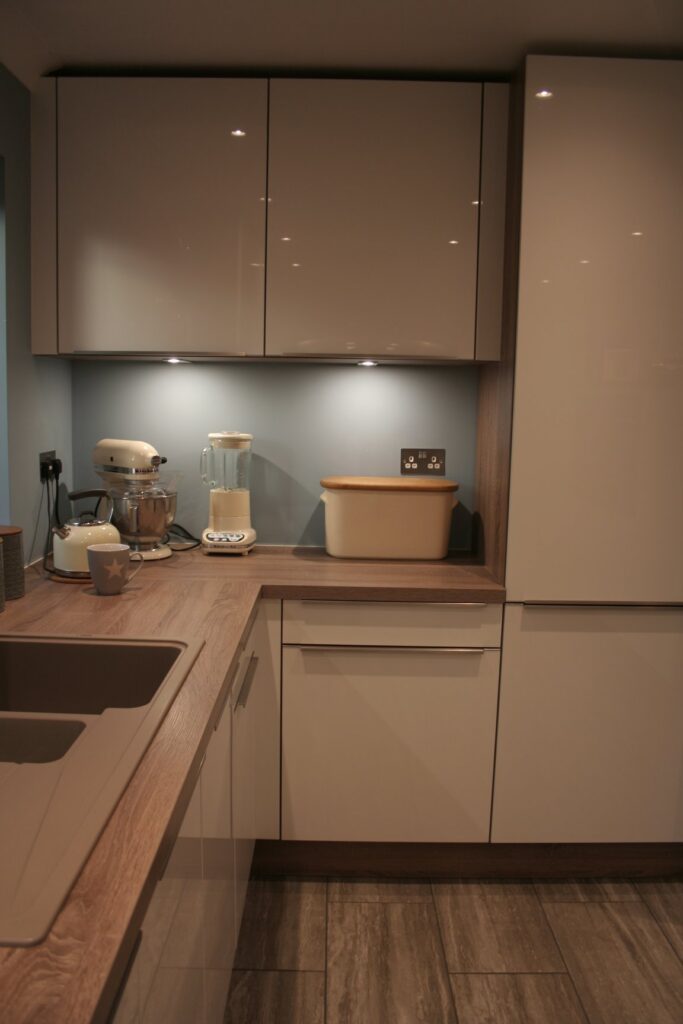 Como High Gloss White, with dark oak — a Störmer kitchen by Kitchensmiths, with oak worktops (photograph 3 of 8)