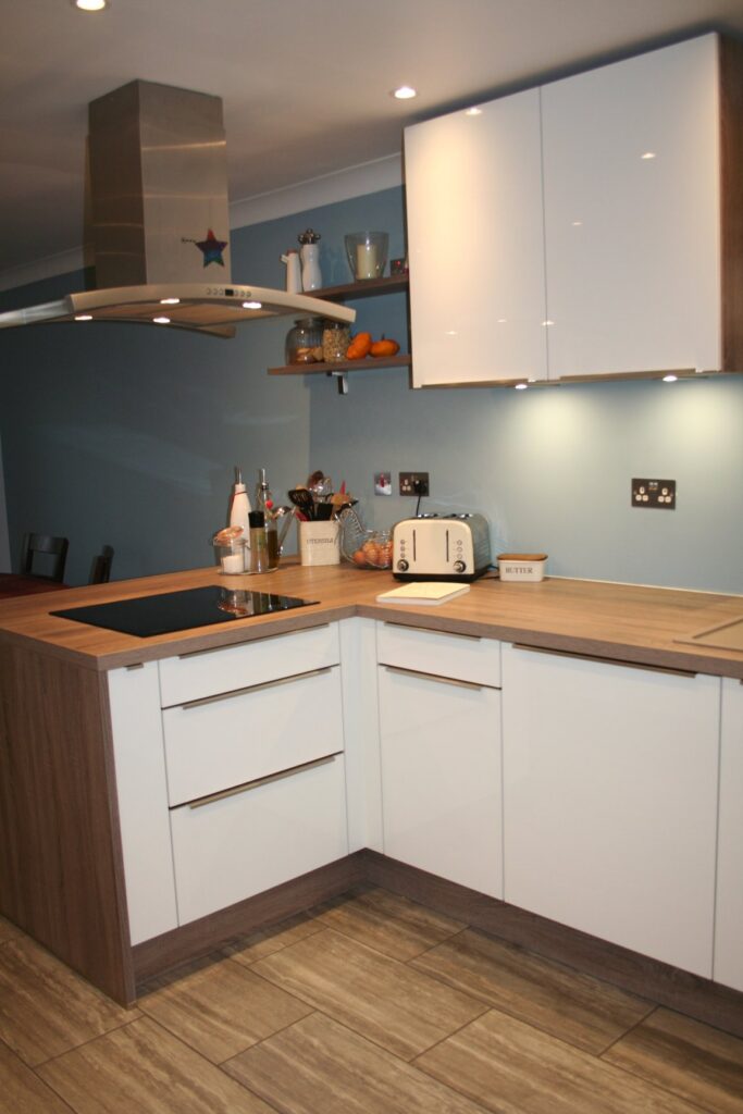 Como High Gloss White, with dark oak — a Störmer kitchen by Kitchensmiths, with oak worktops (photograph 7 of 8)