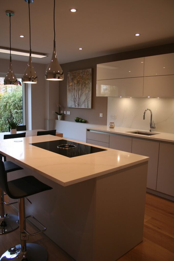 Silky Beige matt and Snow White gloss — a Störmer kitchen by Kitchensmiths, with silestone Calacutta Gold worktops (photograph 1 of 8)