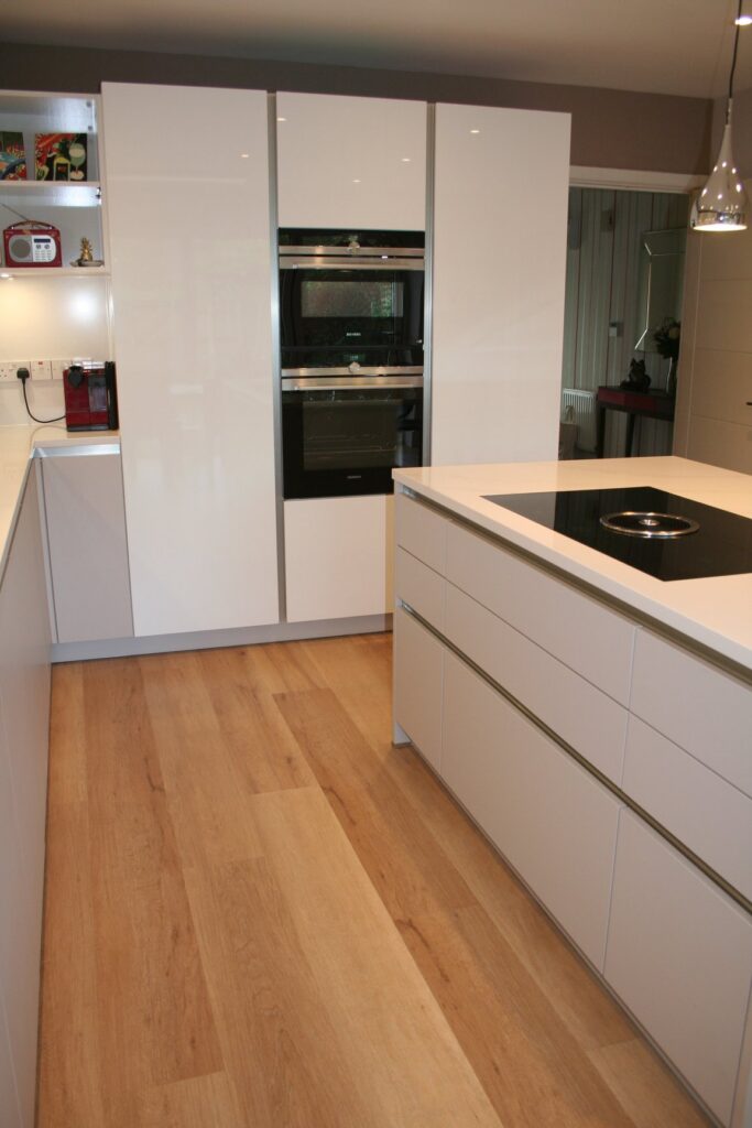 Silky Beige matt and Snow White gloss — a Störmer kitchen by Kitchensmiths, with silestone Calacutta Gold worktops (photograph 7 of 8)