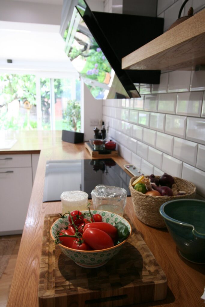 Porcelain White, with a traditional nod — a Rational kitchen by Kitchensmiths, with oak worktops (photograph 1 of 8)