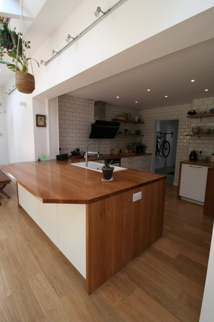 Porcelain White, with a traditional nod — a Rational kitchen by Kitchensmiths, with oak worktops (photograph 2 of 8)