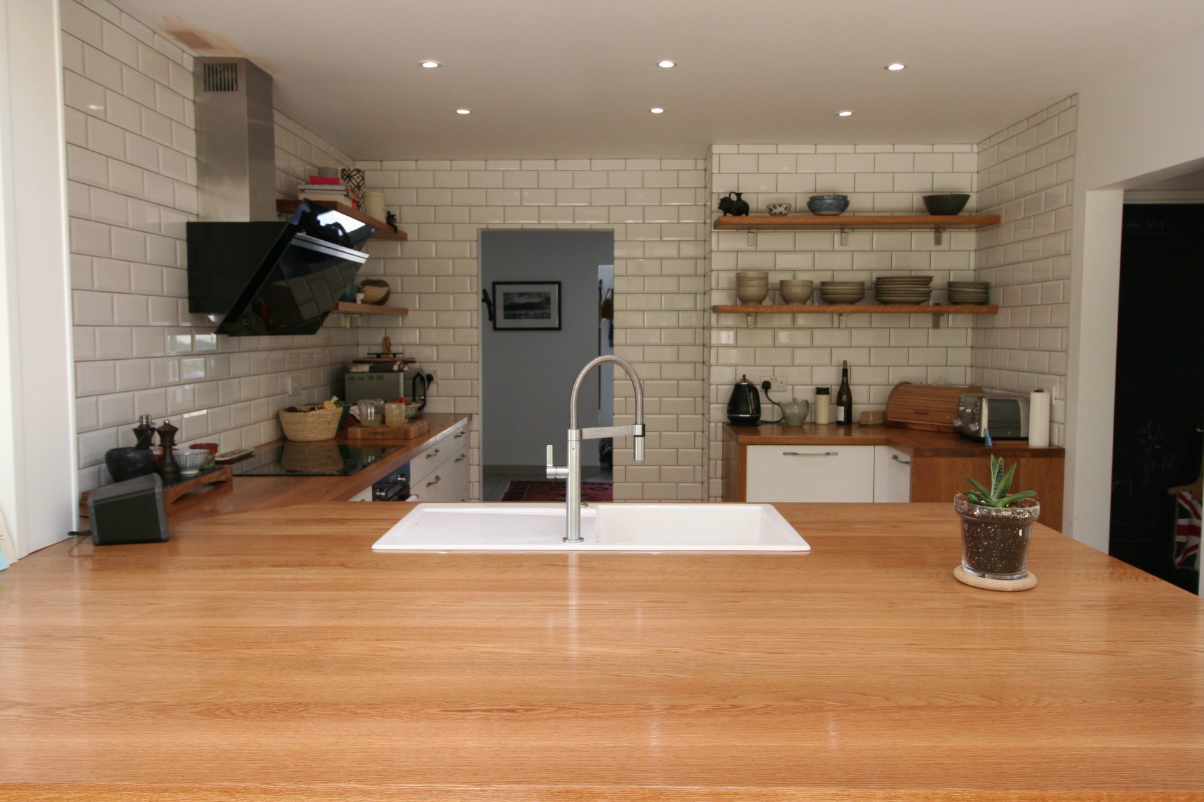Porcelain White, with a traditional nod — a Rational kitchen by Kitchensmiths, with oak worktops (photograph 4 of 8)