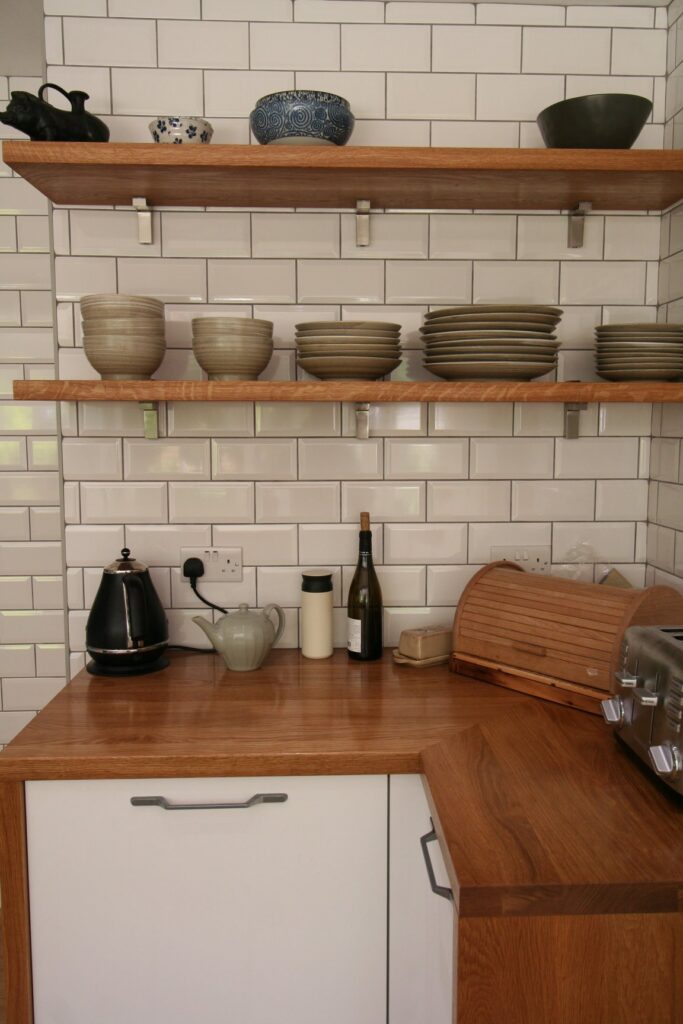Porcelain White, with a traditional nod — a Rational kitchen by Kitchensmiths, with oak worktops (photograph 5 of 8)