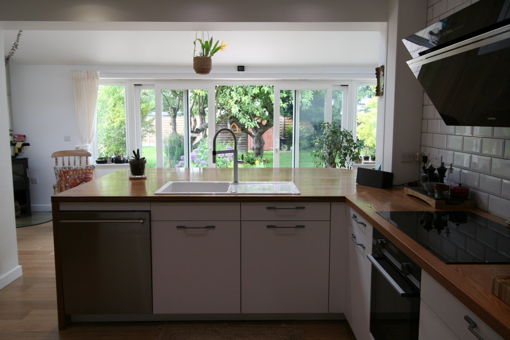 Porcelain White, with a traditional nod — a Rational kitchen by Kitchensmiths, with oak worktops (photograph 6 of 8)