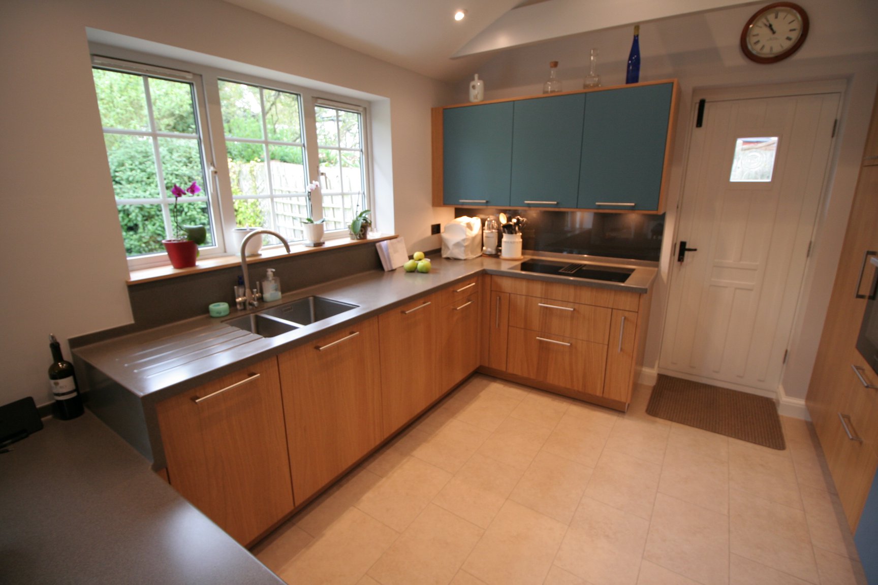 Bookmatched light oak and matt teal — a BAX kitchen by Kitchensmiths, with corian worktops (photograph 3 of 3)