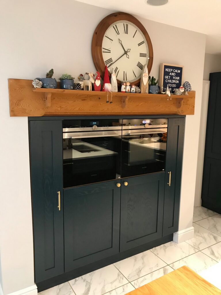 Blue Hague painted oak, and handmade brass — a Stoneham kitchen by Kitchensmiths (photograph 1 of 5)