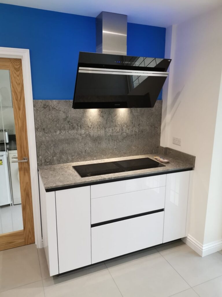 White high gloss TIO — a Rational kitchen by Kitchensmiths, with caesarstone worktops (photograph 1 of 4)