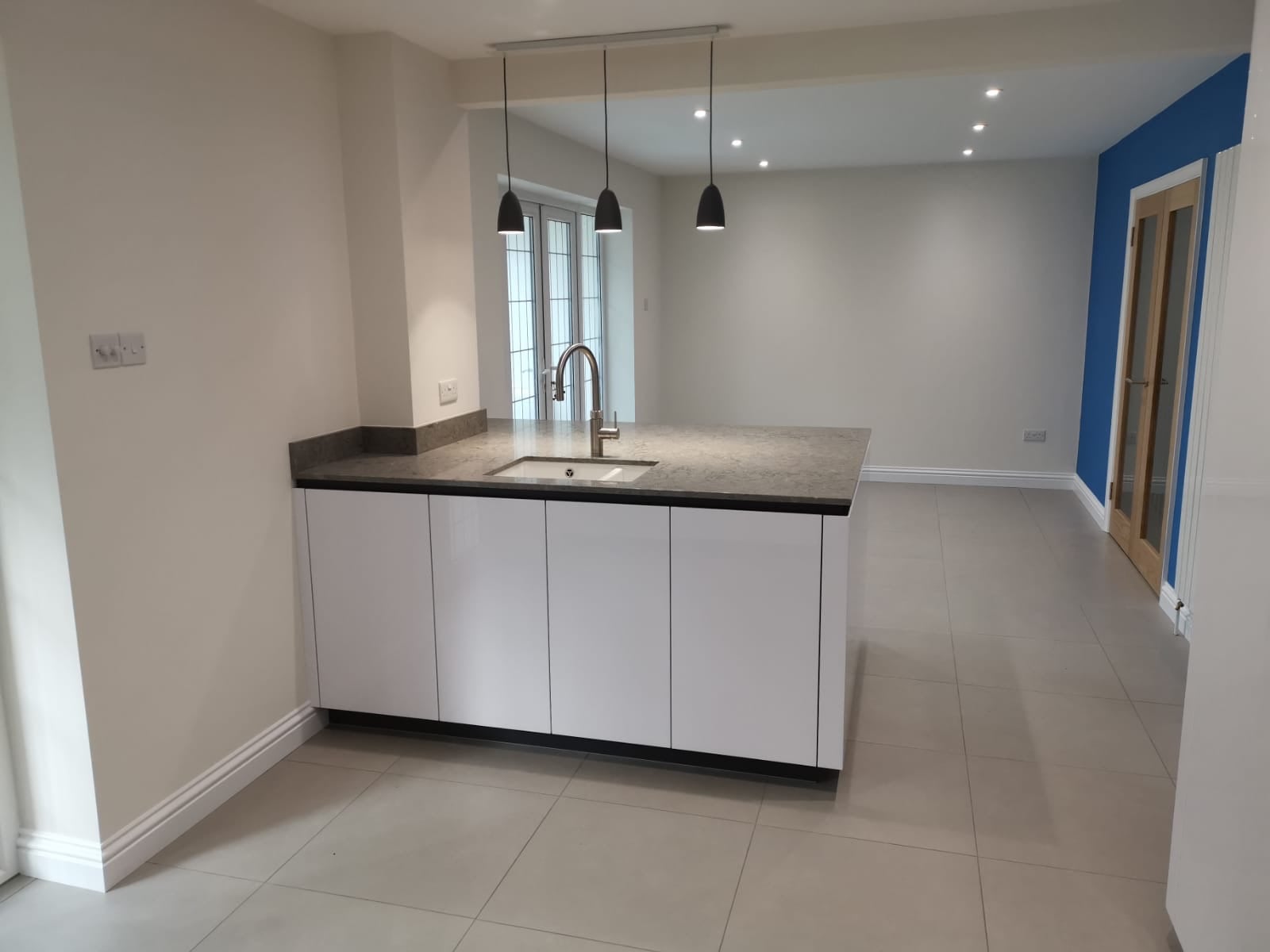 White high gloss TIO — a Rational kitchen by Kitchensmiths, with caesarstone worktops (photograph 3 of 4)