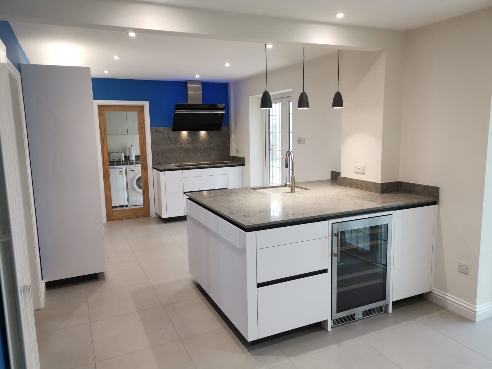 White high gloss TIO — a Rational kitchen by Kitchensmiths, with caesarstone worktops (photograph 4 of 4)