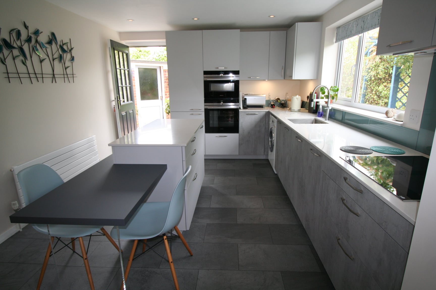 Concrete Grey, and an island that does both jobs — a Rational kitchen by Kitchensmiths (photograph 2 of 4)
